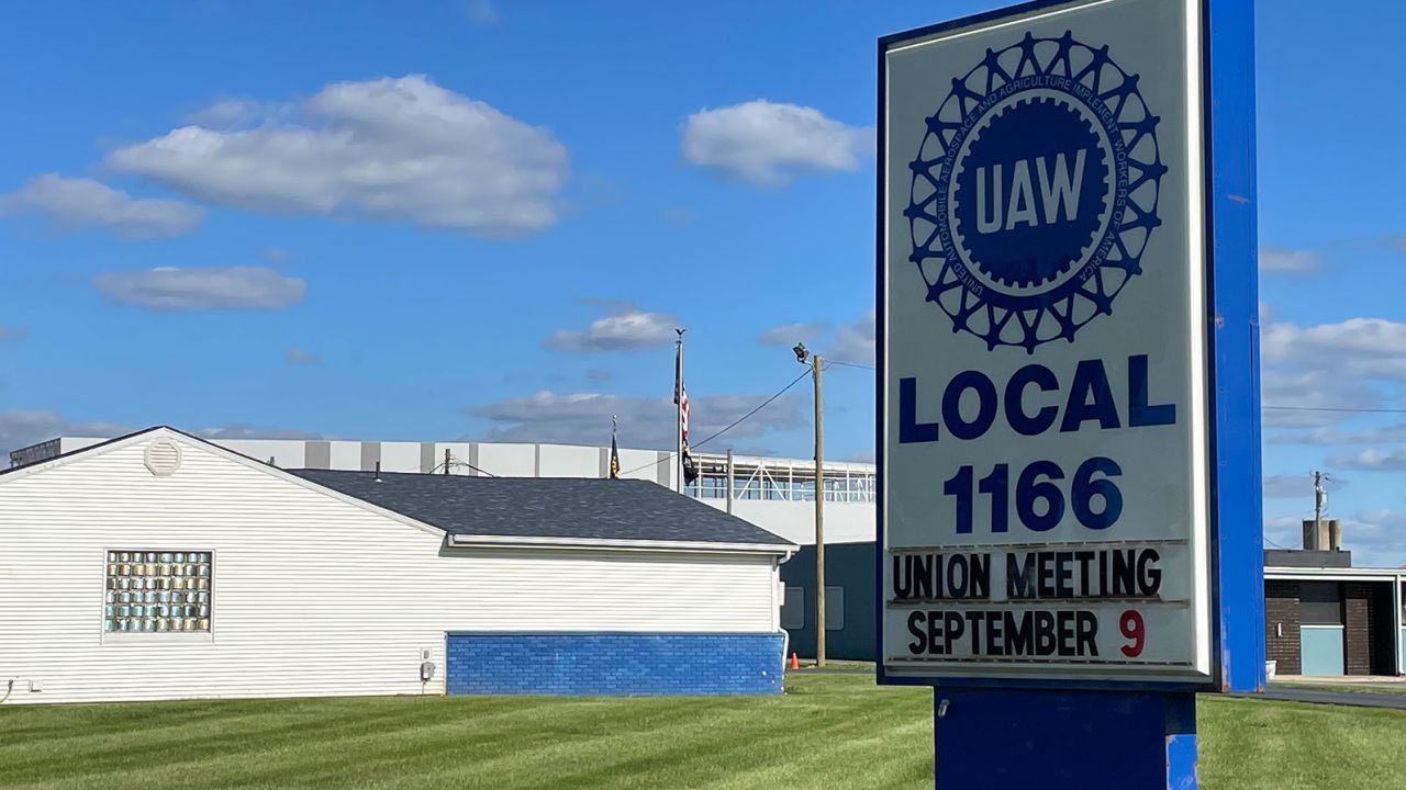 The EV battery plant being built by Stellantis and Samsung in Kokomo, in the background, is right across the street from one of the United Auto Workers union halls in the town where current unionized factories could be threatened by the shift to EVs.