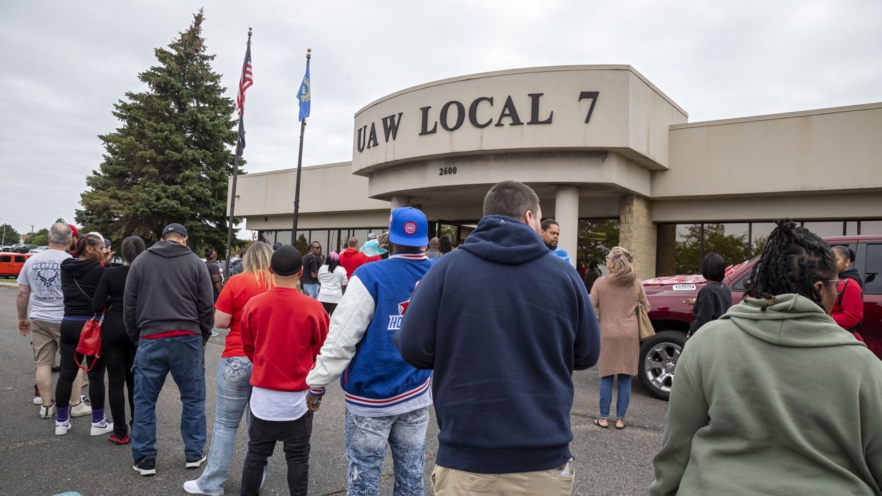 Members of the United Auto Workers union line up to enter a membership meeting in advance of the September 14 expiration of their union contract with Stellantis, Ford, and General Motors on September 10, 2023, Detroit, Michigan.