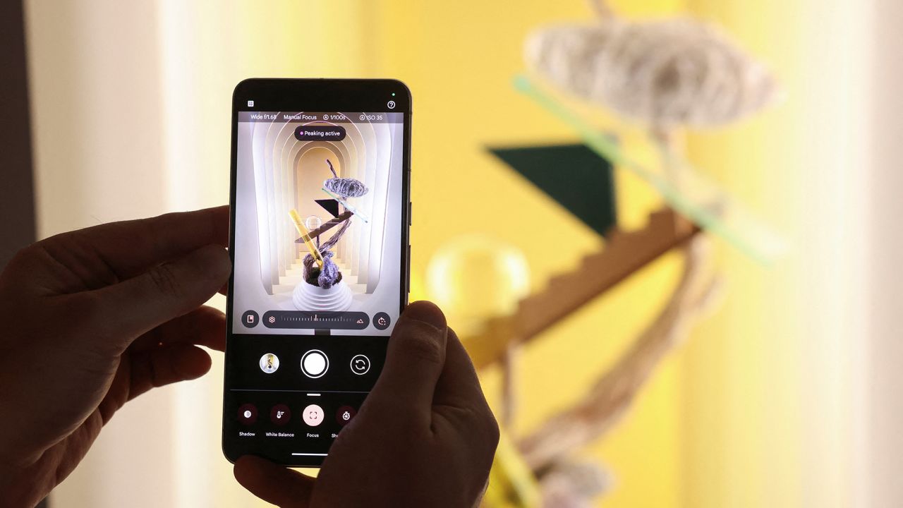 A Google employee demonstrates manual focus features of the new Google Pixel 8 Pro Phone in New York City, U.S., October 4, 2023.