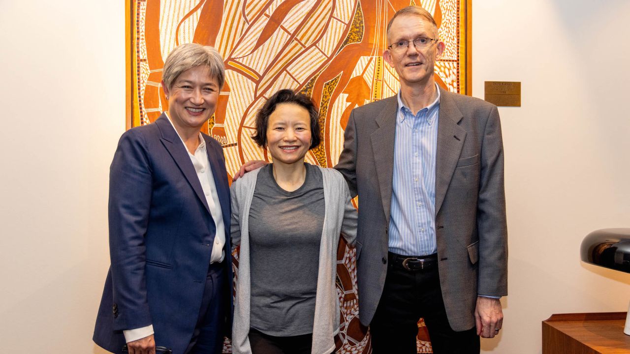 Cheng Lei (middle) returns to Australia at the Tullamarine Airport in Melbourne on 11 October.
