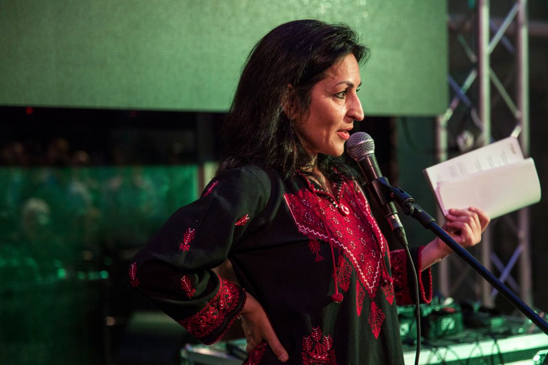 Susan Abulhawa, a Palestinian-American writer and human rights activist,  speaks at a 2014 Palestine Festival of Literature event at Qasr al Qassem on June 4, 2014 in Beit Wazan, near Nablus, West Bank.