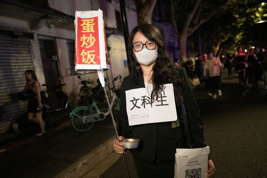 A woman dressed up as a liberal arts student hungry for egg fried rice.